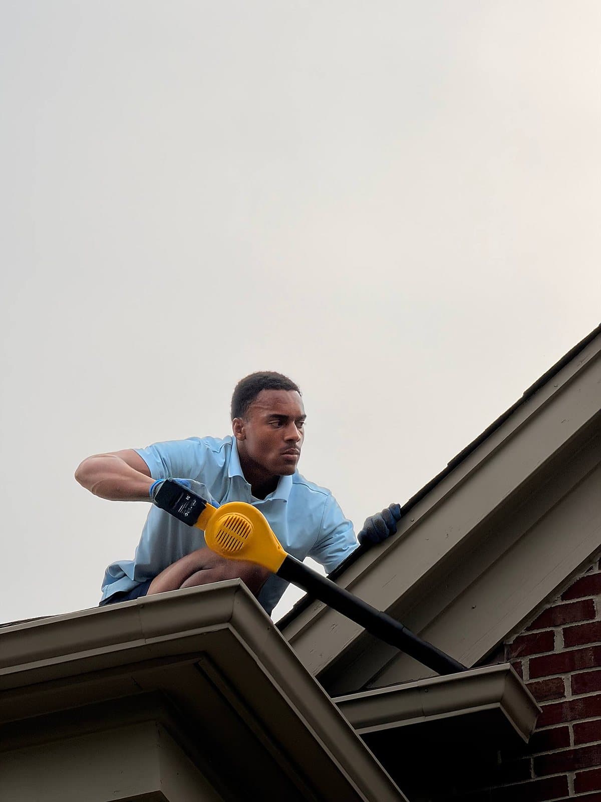 Blowing leaves and debris out of the gutters on a wash day