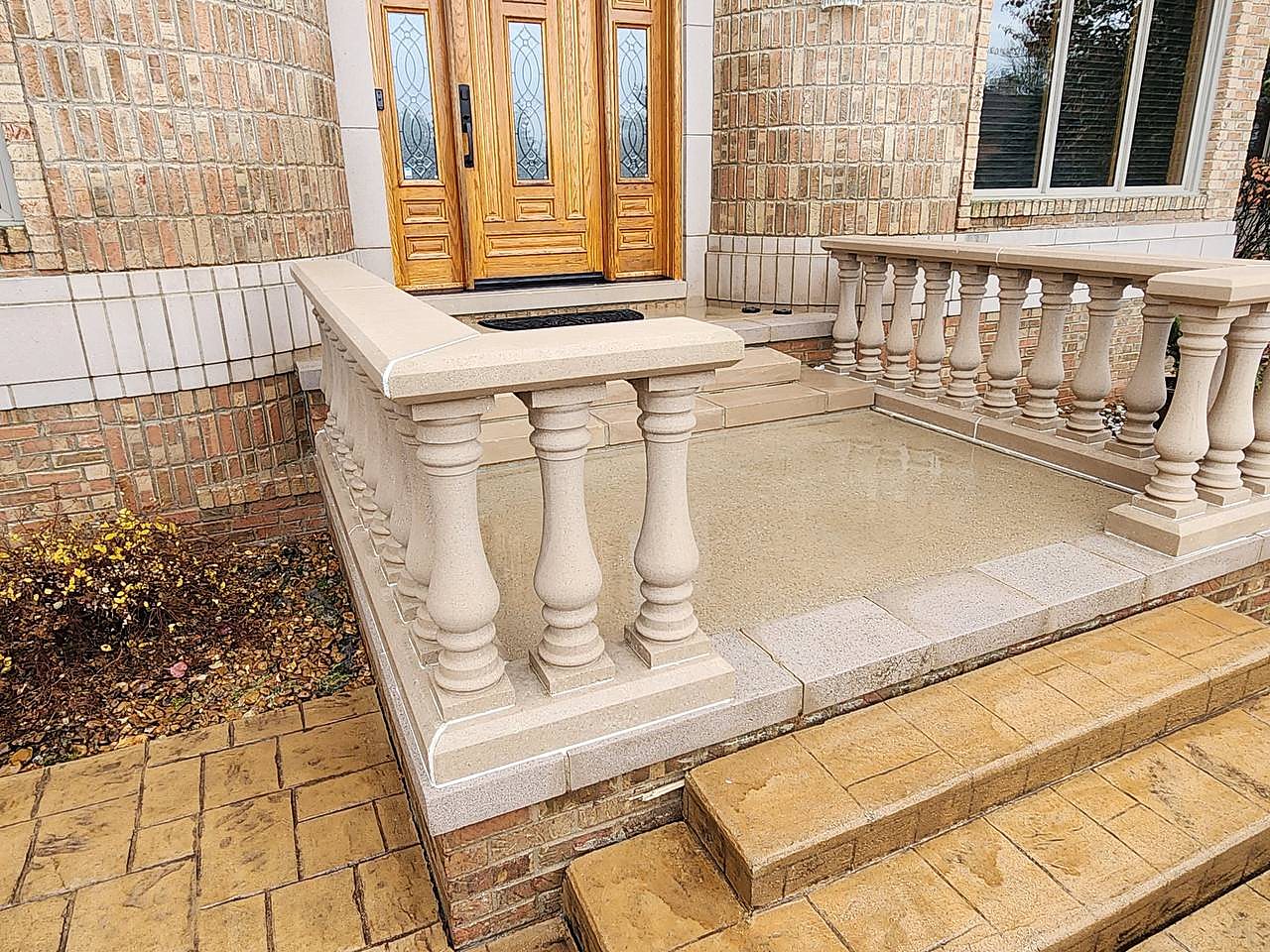 Stone balustrade porch soft washed in Macomb, MI