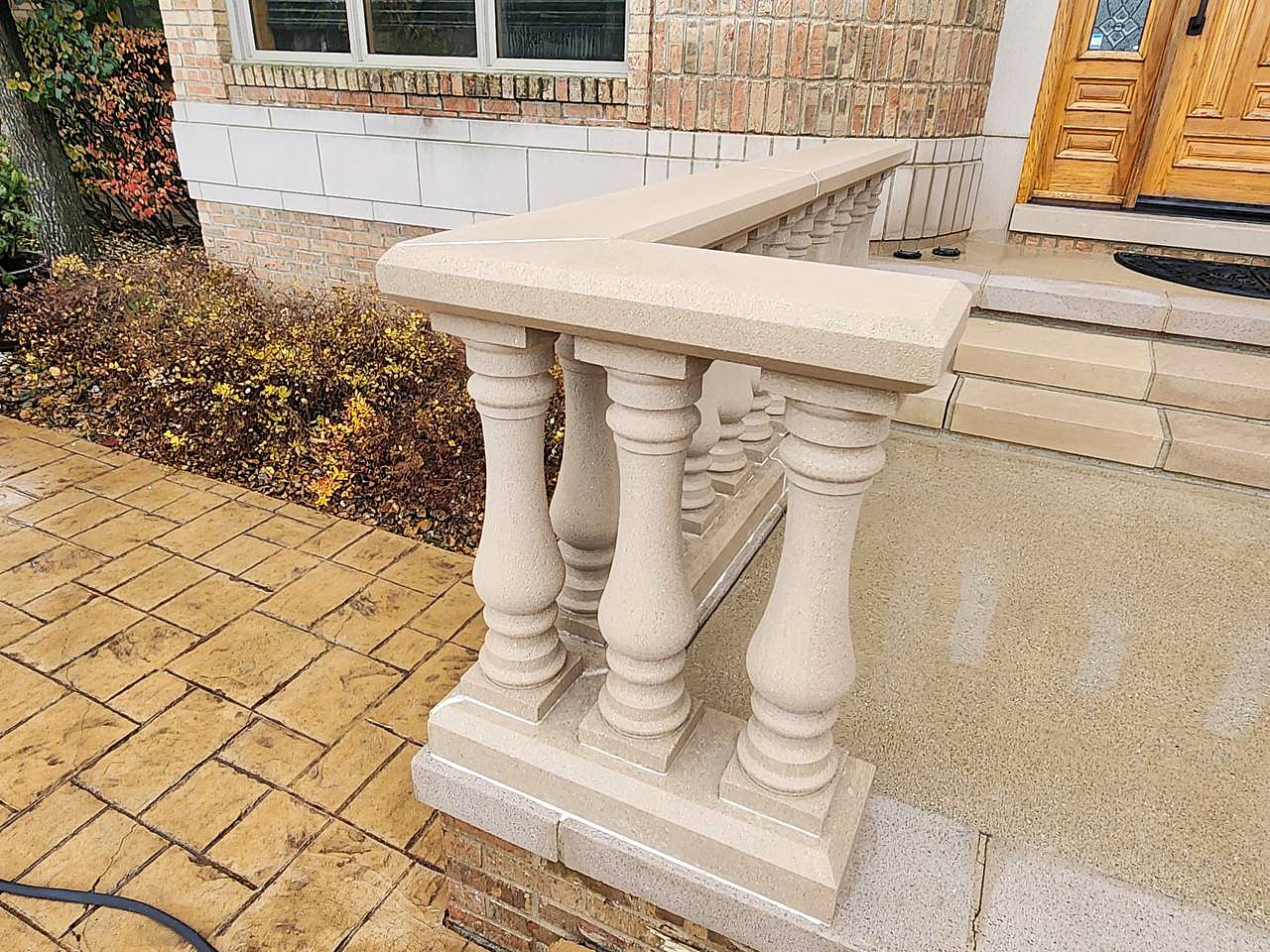 Stone porch railing soft washed in Metro Detroit