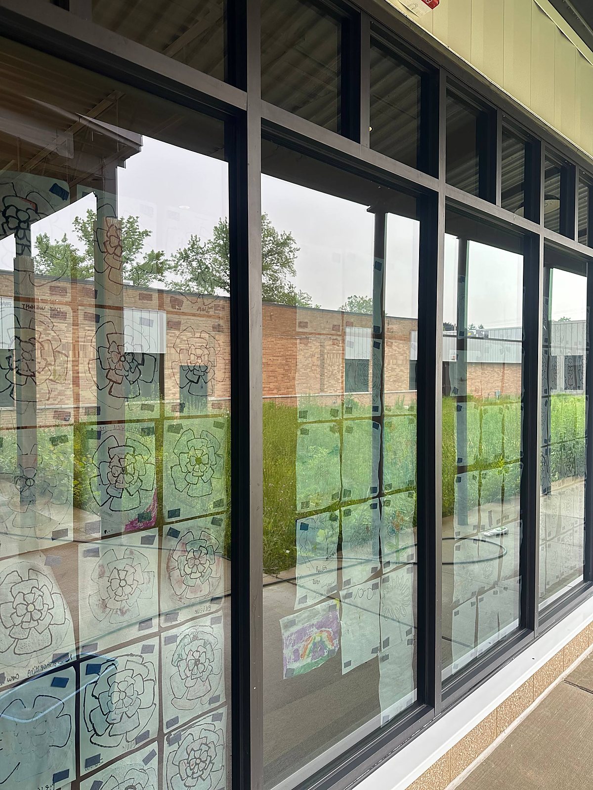 Tall storefront glass panel cleaned at a commercial building in Macomb County