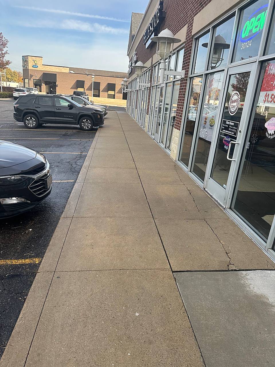 Bakery storefront sidewalk pressure washed in Metro Detroit
