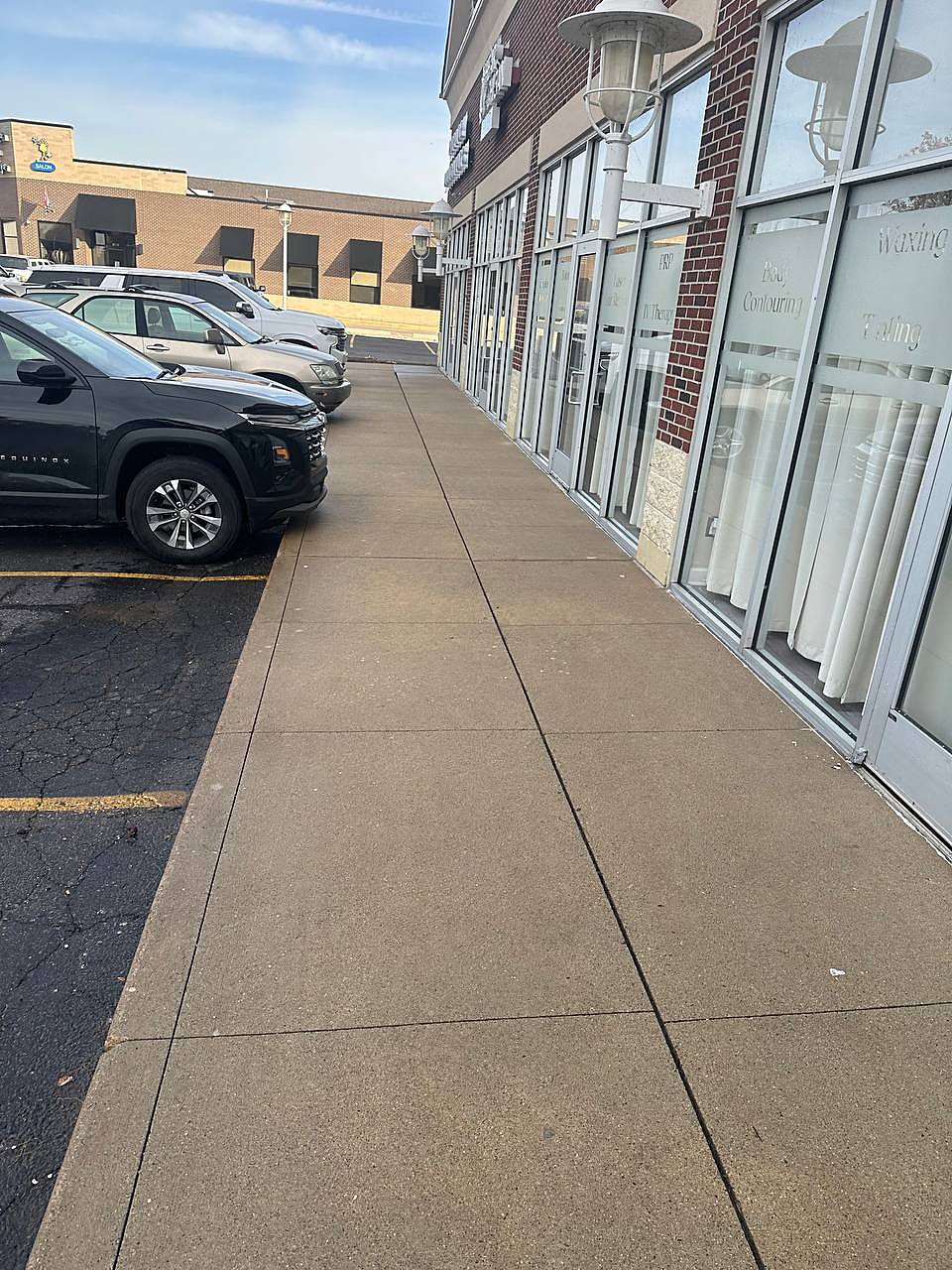 Salon storefront sidewalk cleaned in Metro Detroit