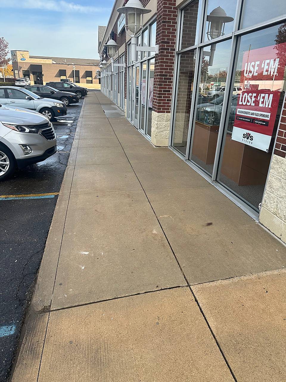 Retail sidewalk pressure washed clean in Macomb County