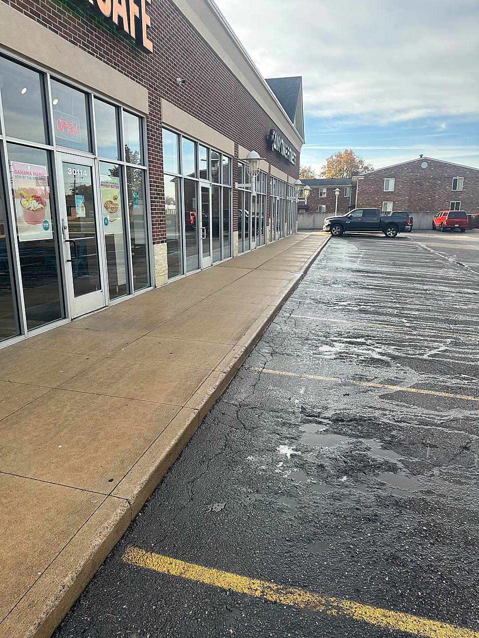 Cafe storefront walkway after commercial pressure washing