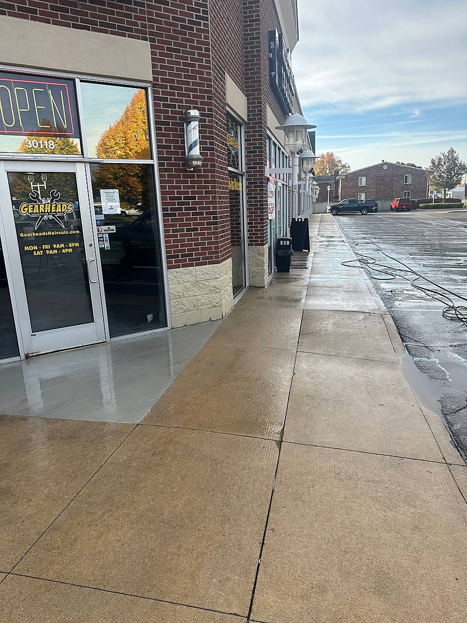 Barbershop corner sidewalk freshly pressure washed