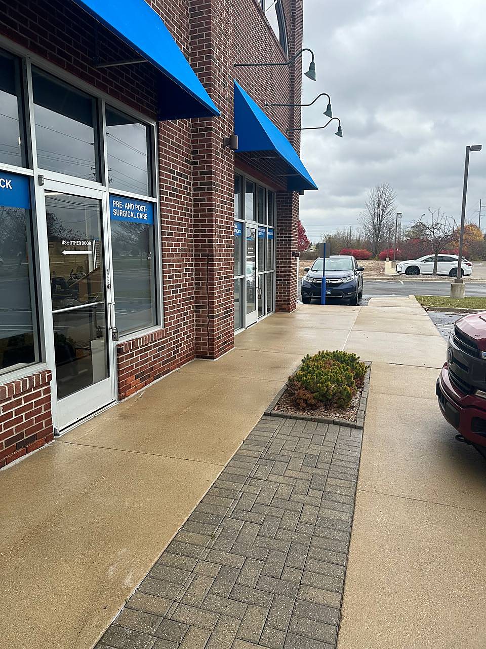 Medical office storefront walkway pressure washed in Metro Detroit