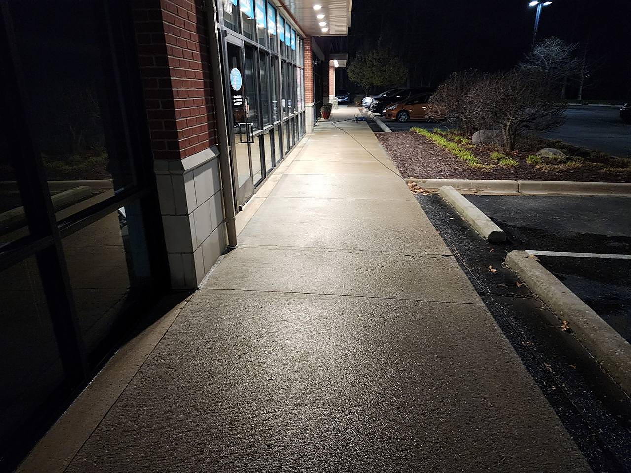 Commercial sidewalk cleaned during overnight service