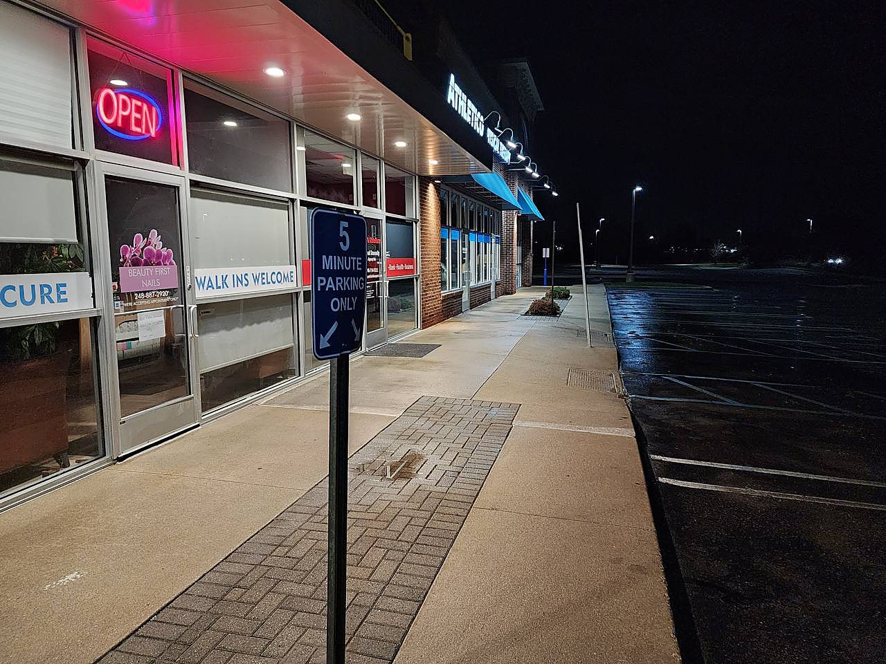 Retail walkway pressure washed after hours