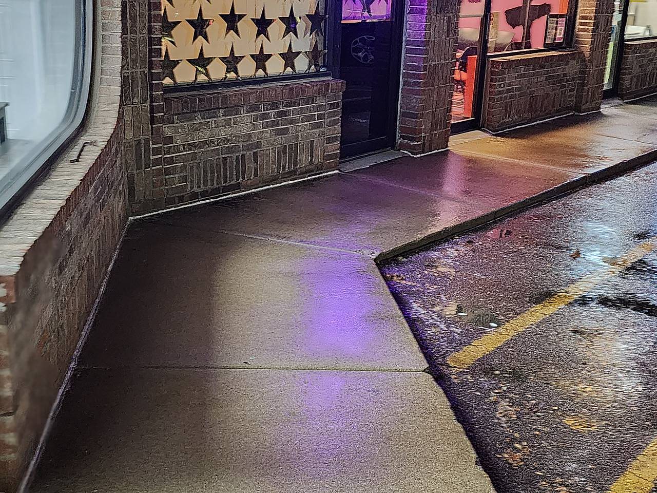 Brick storefront sidewalk washed overnight in Metro Detroit