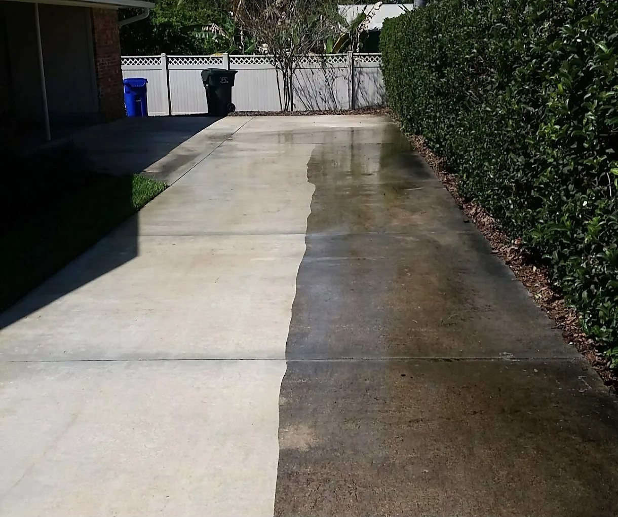Driveway before and after pressure washing in Metro Detroit