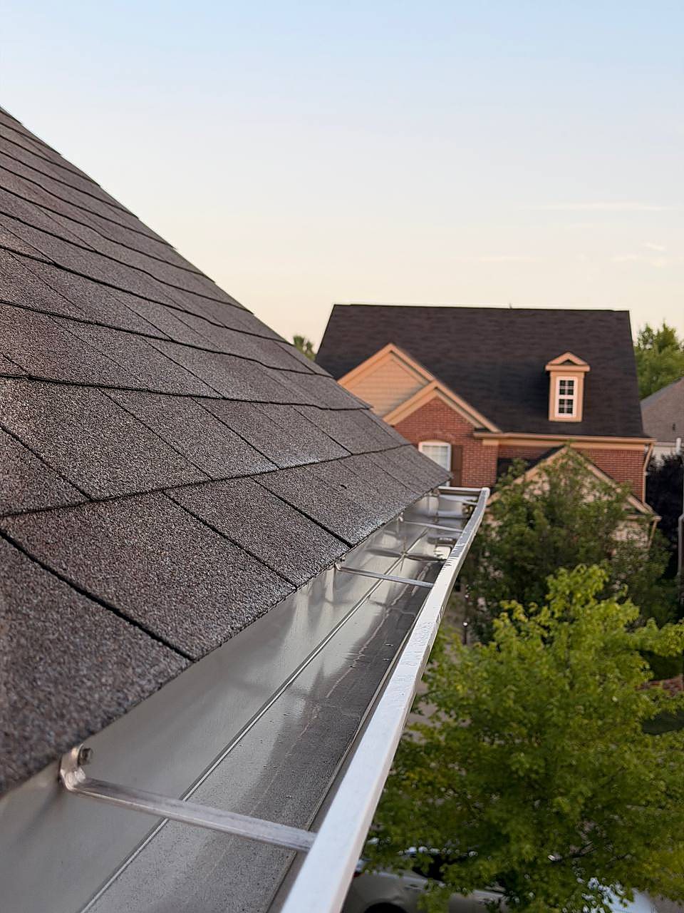 Cleared gutter guards on a shingle roof in Macomb, MI