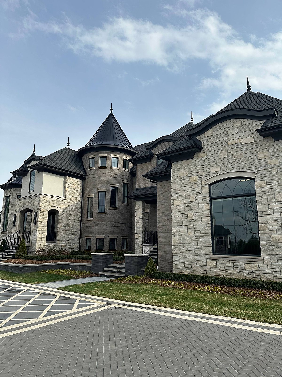 Stone castle-style home, side elevation cleaned in Macomb, MI