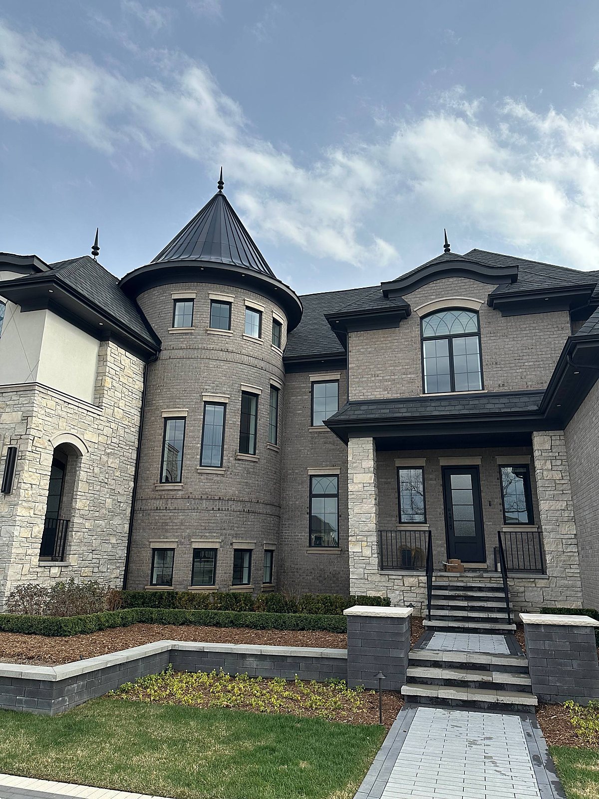 Stone and brick home with turret, exterior cleaned in Metro Detroit