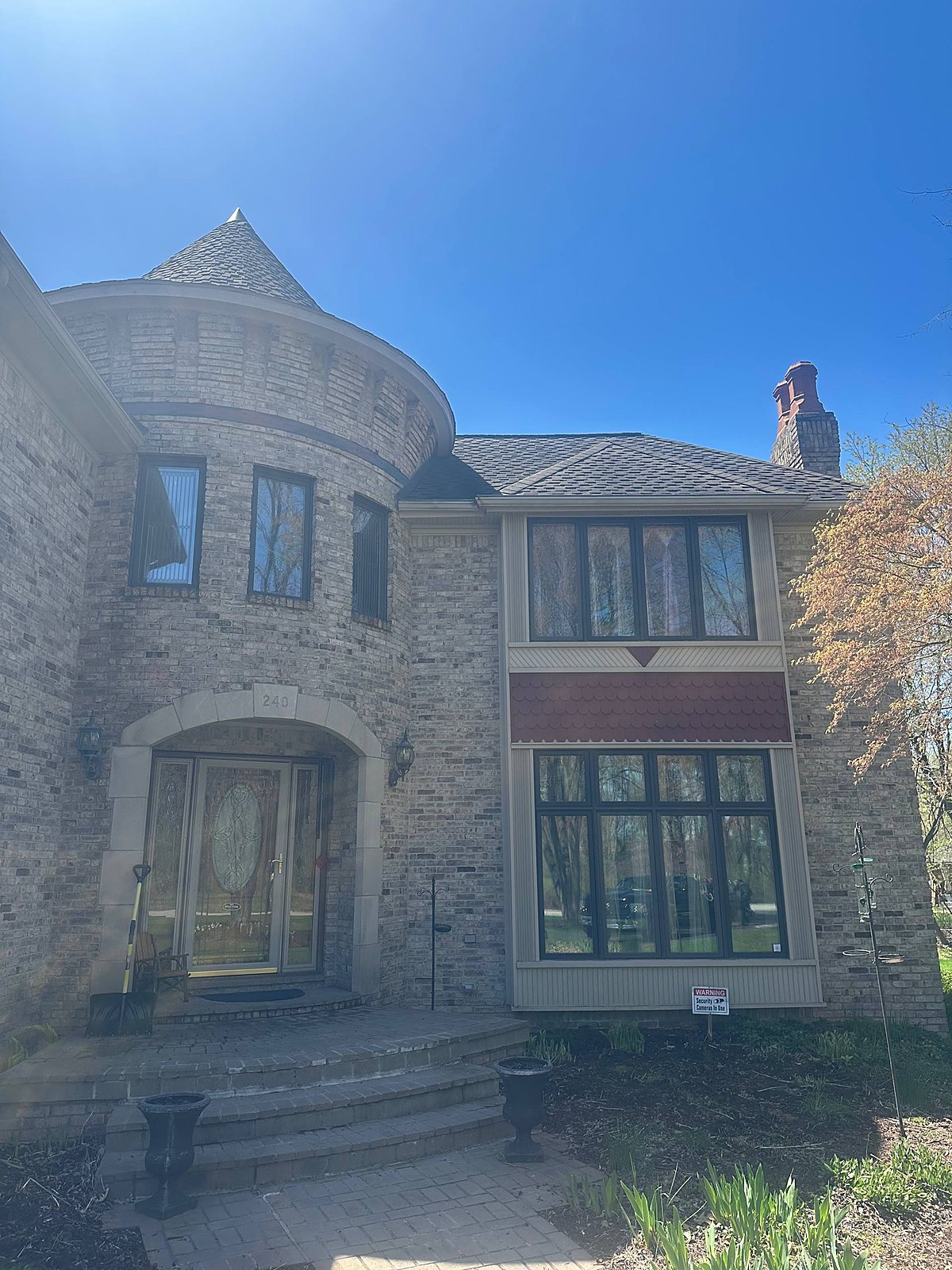 Cream brick Tudor home, front entry and windows cleaned in Macomb, MI