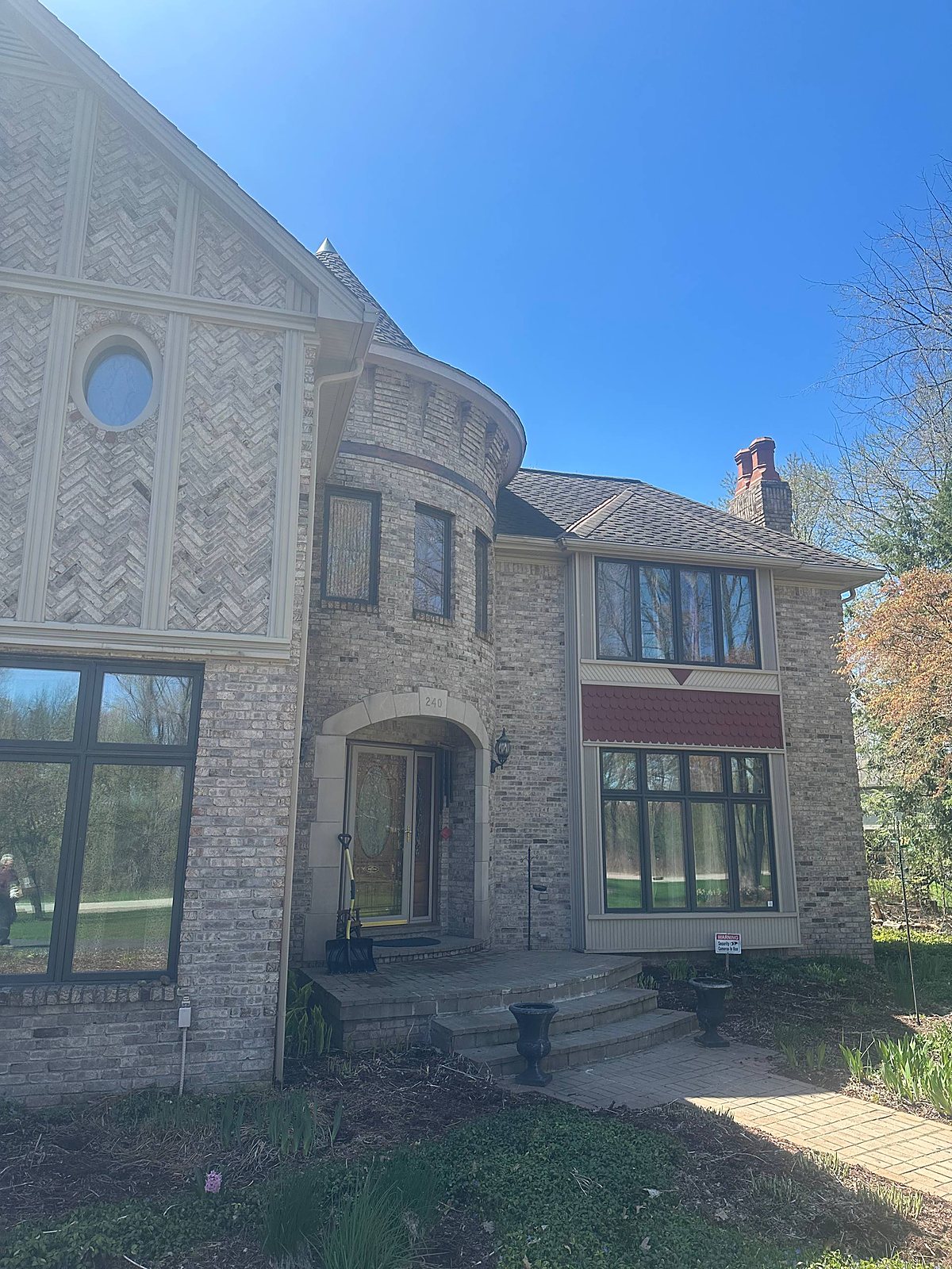 Cream brick Tudor-style home, exterior cleaned in Macomb, MI