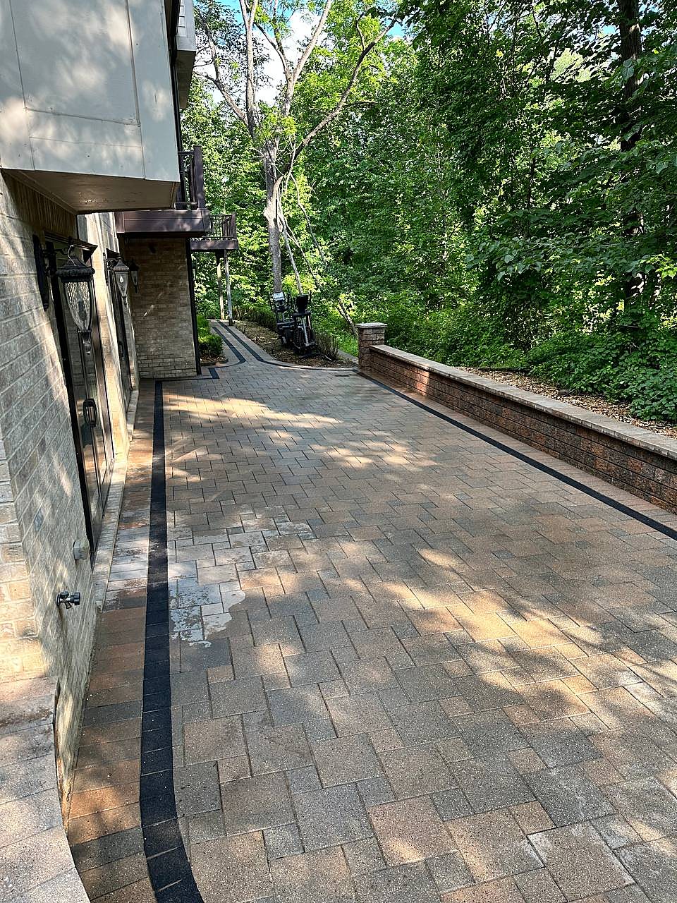 Paver driveway cleaned along a Macomb, MI home