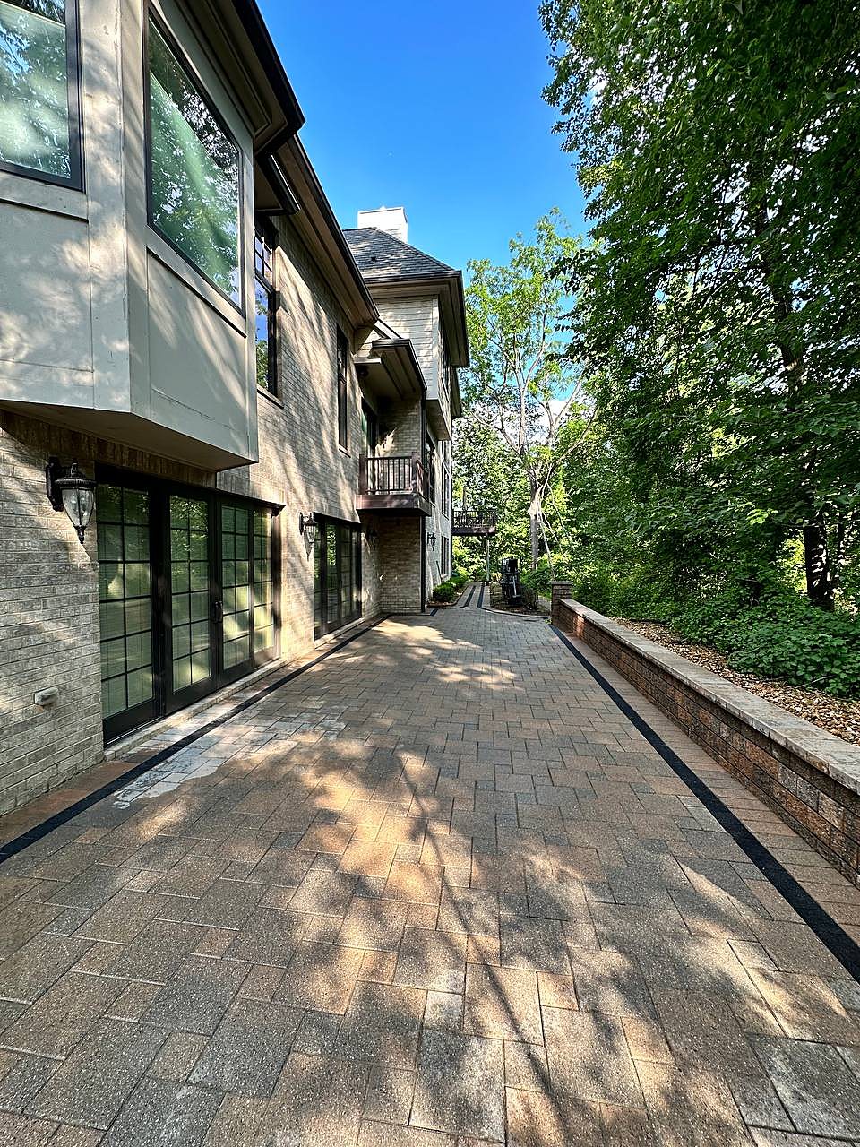 Brick paver driveway pressure washed in Metro Detroit