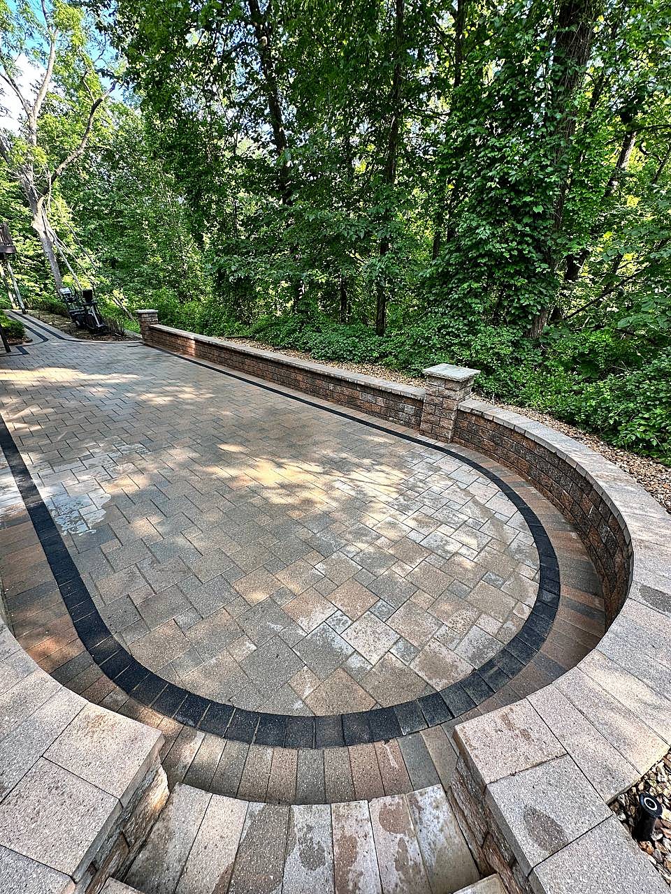 Rounded paver patio washed clean with border detail