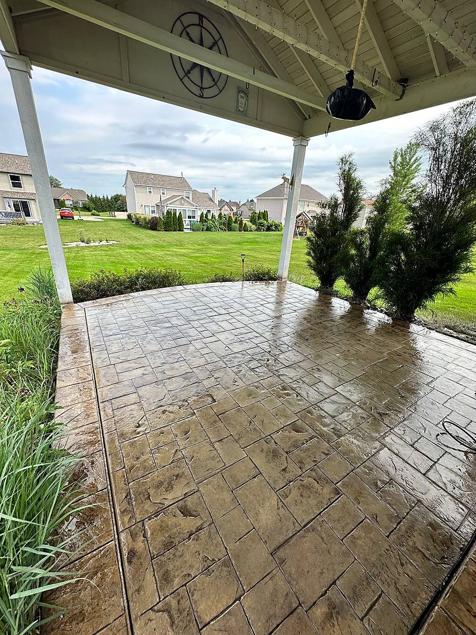 Covered stamped concrete patio freshly washed