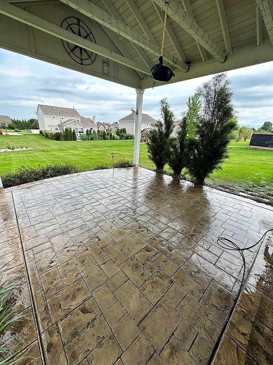 Stamped concrete patio under a gazebo cleaned in Metro Detroit