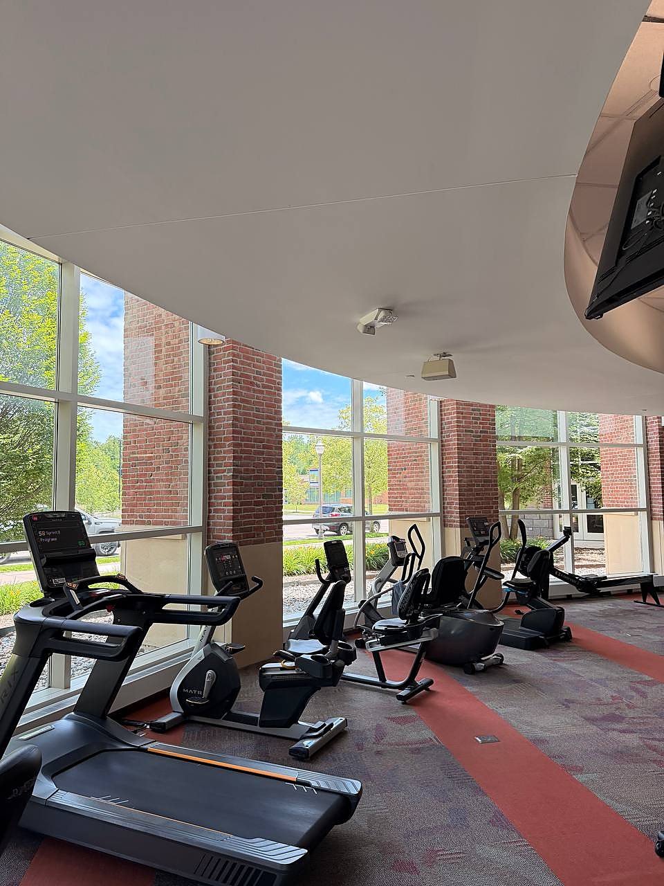 Floor to ceiling gym windows cleaned clear in Macomb County