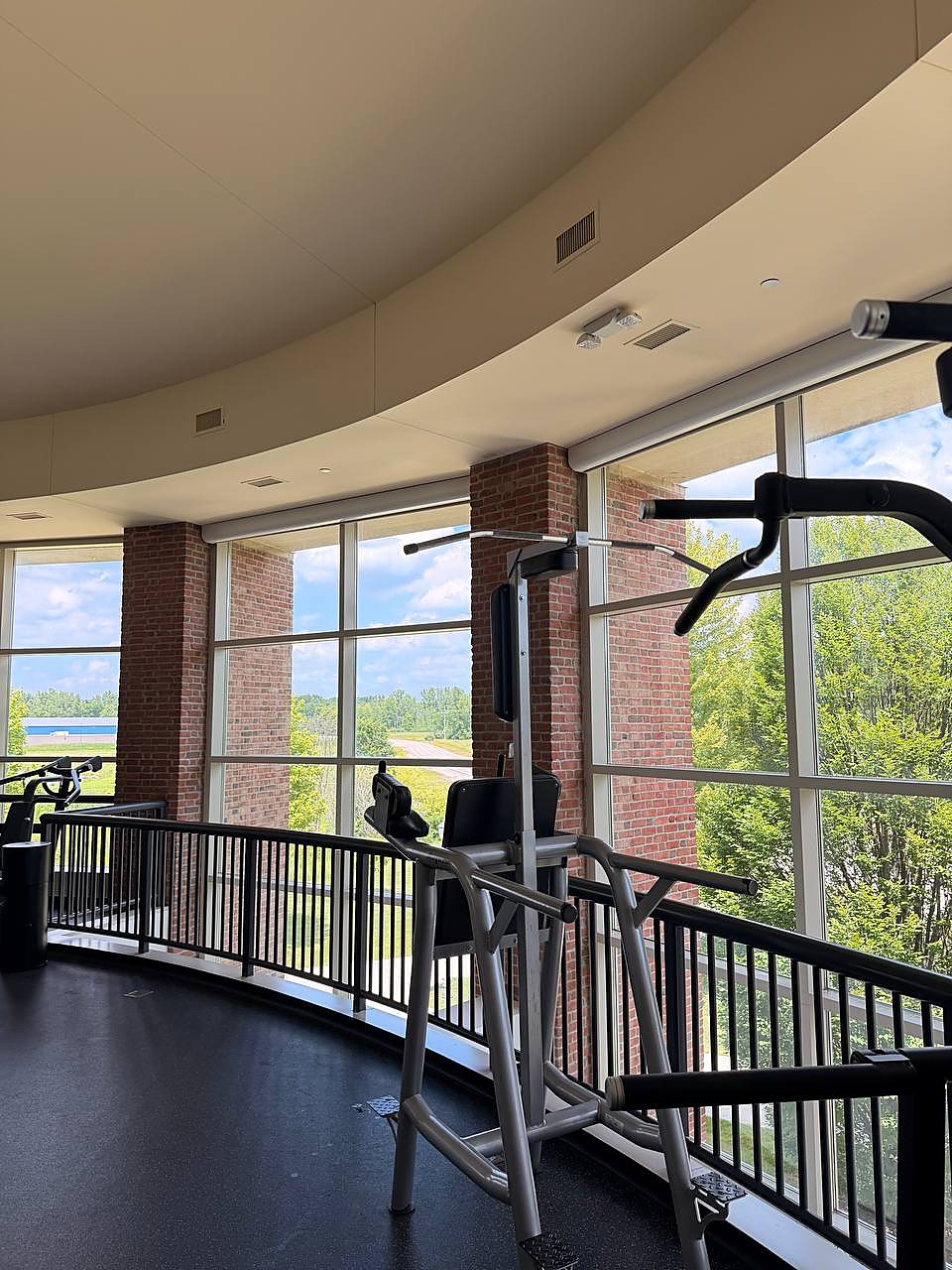 Curved commercial window wall cleaned in Macomb, MI
