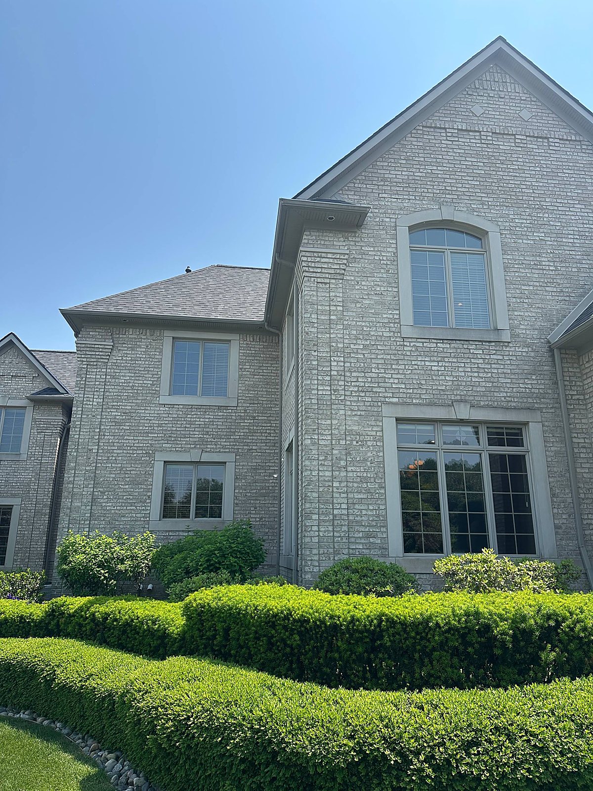 Gray brick gable and washed exterior on a Metro Detroit home