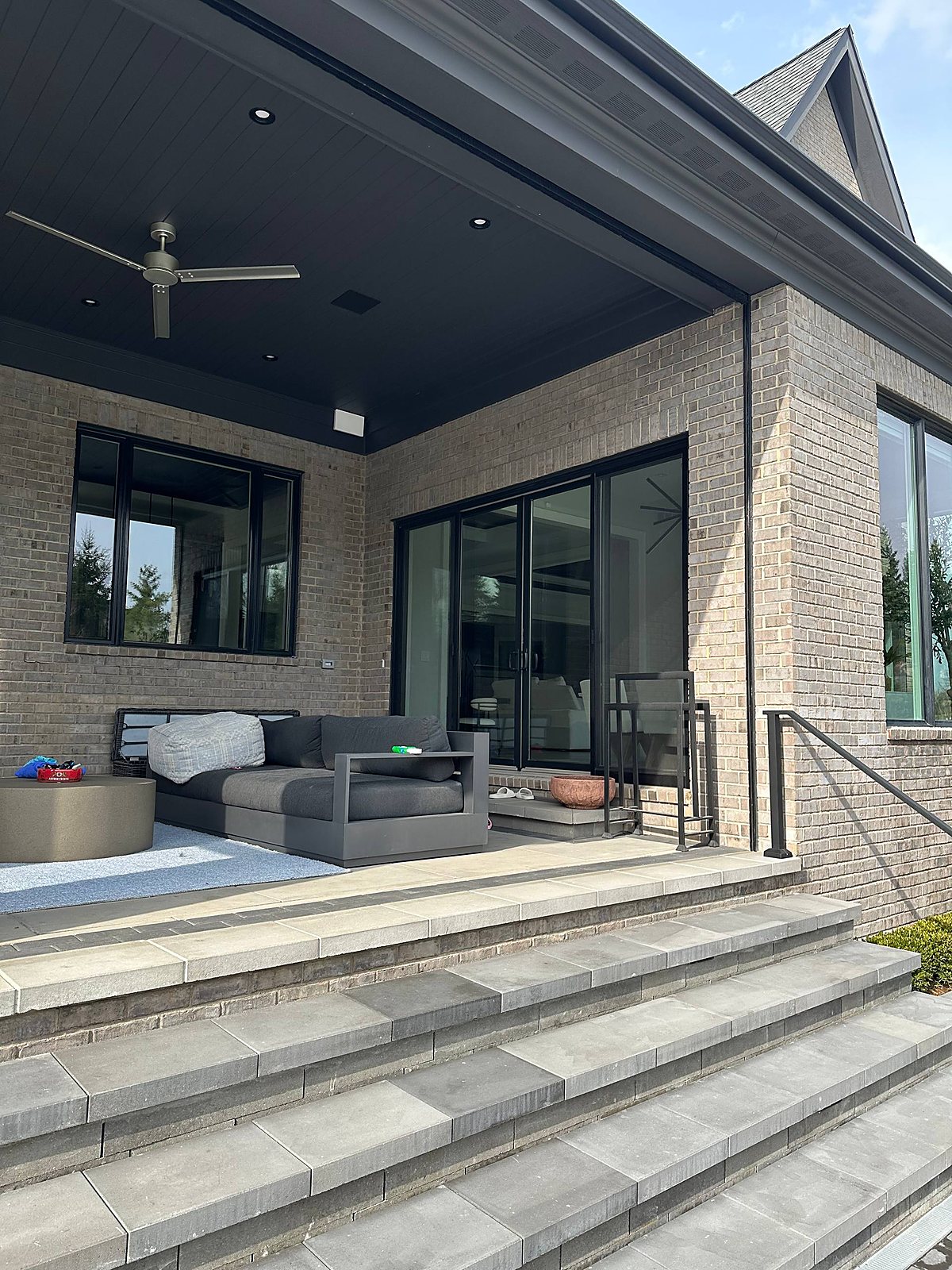 Gray brick home, covered patio doors and windows cleaned in Metro Detroit