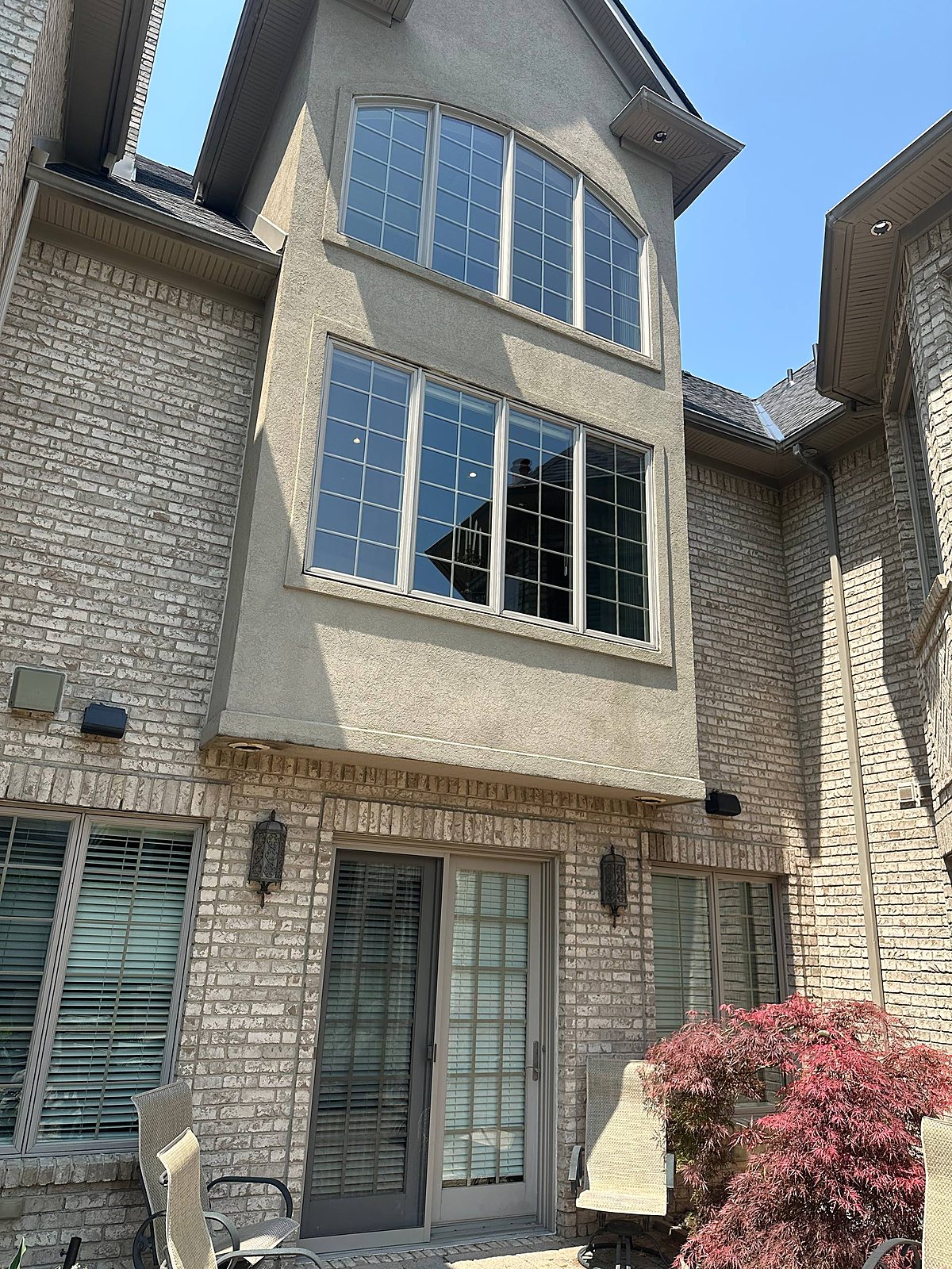 Twin arched gable windows cleaned clear in Metro Detroit
